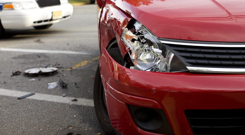 red-car-damaged-headlight