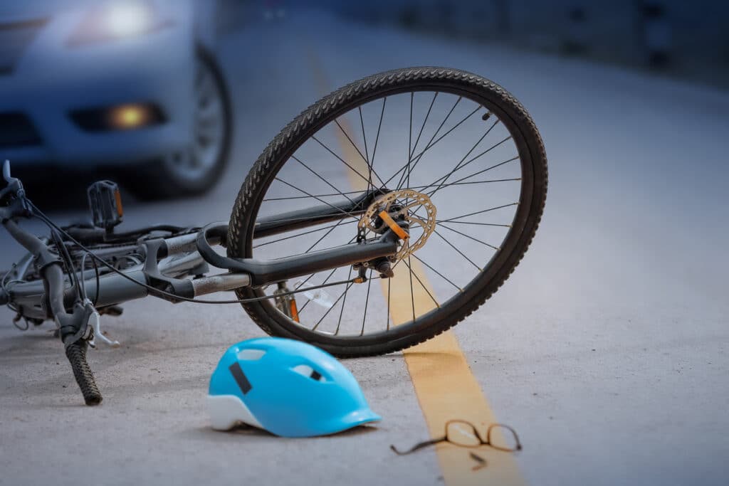 An overturned bicycle after a crash that landed a state representative and police chief named in a wrongful death claim.