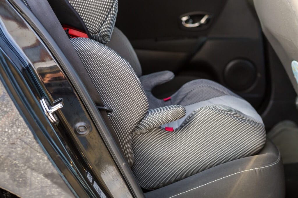 Close-up of a comfortable chair seat in car interior for a toddler.