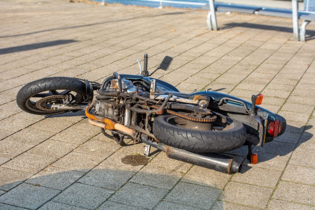 A fallen motorcycle on its side.