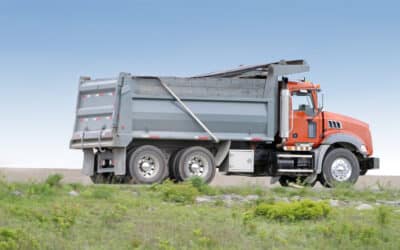 Woman Injured After Her Car Becomes Pinned Beneath a Dump Truck