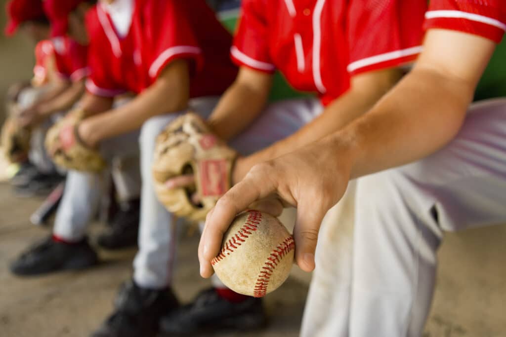 Baseball players in the dugout during a game.