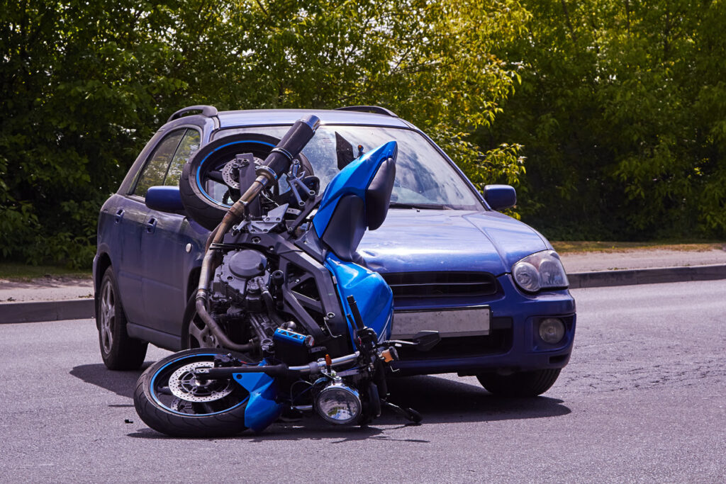 A motorcycle damaged in an accident with a car.