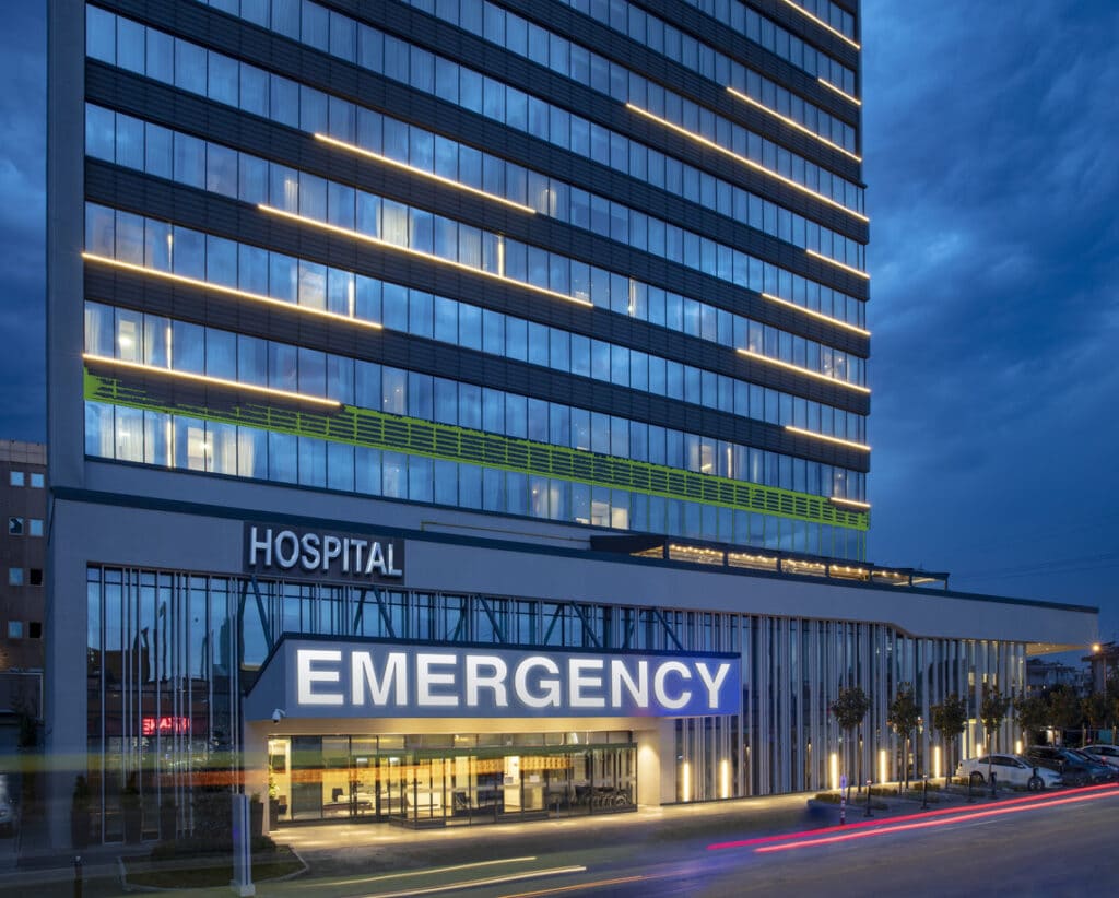 An exterior shot of a modern hospital building.