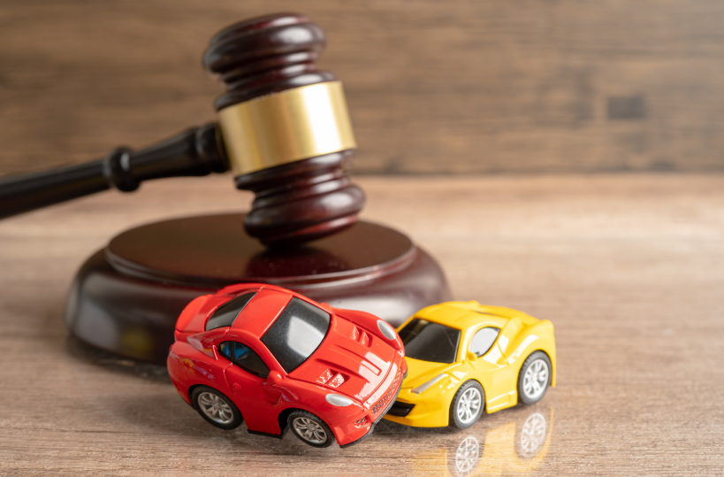 Toy cars near a gavel